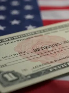 Stimulus check with American flag background representing government financial support