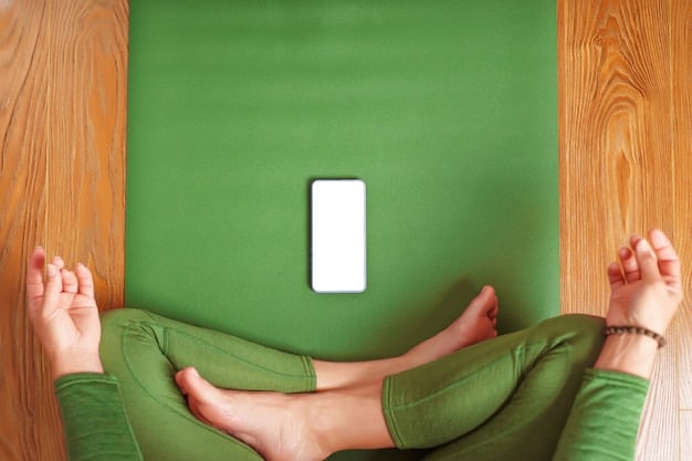 A person meditating with their phone lying face down next to them, symbolizing the practice of mindfulness and being present in the moment without digital distractions.