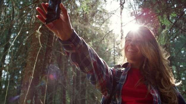 A person smiling and engaging in a real-life activity like hiking or painting, showing a sense of joy and freedom away from technology. The scene is bright and positive.