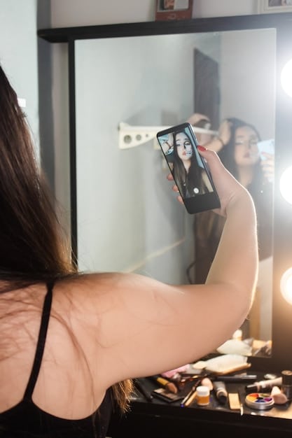 A split screen showing a woman looking at her reflection in a mirror on one side, and on the other side, the same woman editing her photo on a phone app with filters and body altering tools.