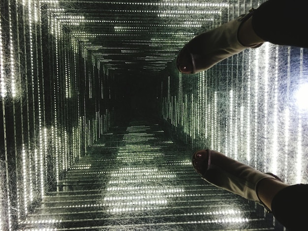 A visual representation of a VPN tunnel. The graphic depicts data packets traveling through a secure, encrypted tunnel between the user's device and a remote server. The tunnel is clearly marked as 