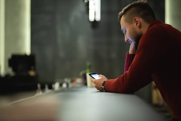 A person using a smartphone with a notification alert about suspicious activity on their bank account. The image emphasizes the importance of timely alerts and mobile access to identity theft protection services.