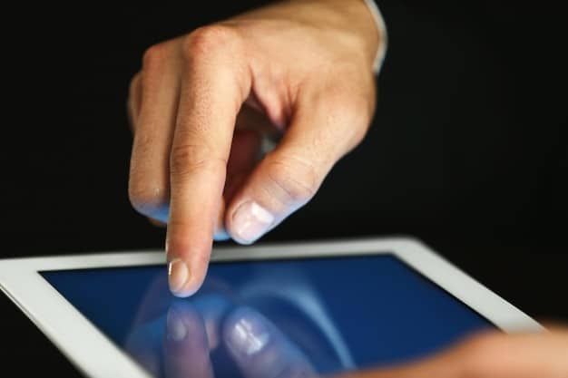 A close-up of a hand navigating a digital tablet displaying various cybersecurity icons like a padlock, shield, and firewall, against a blurred background of office workers. The image communicates digital security in a corporate setting.