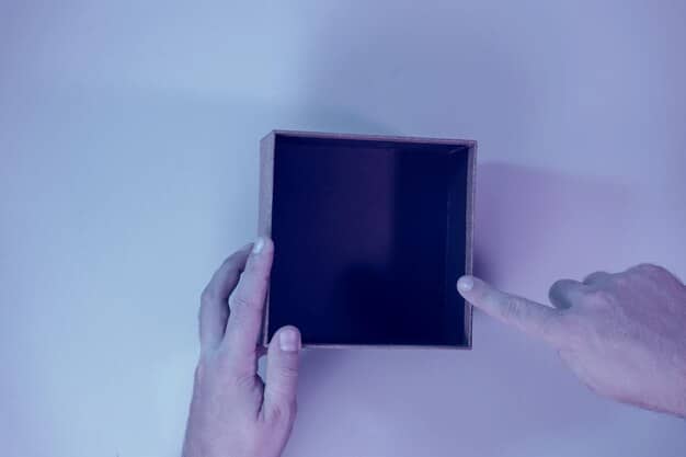 A person's hands delicately unwrapping a new, sleek electronic device with soft lighting, emphasizing the textures and the unboxing experience in an ASMR video style.